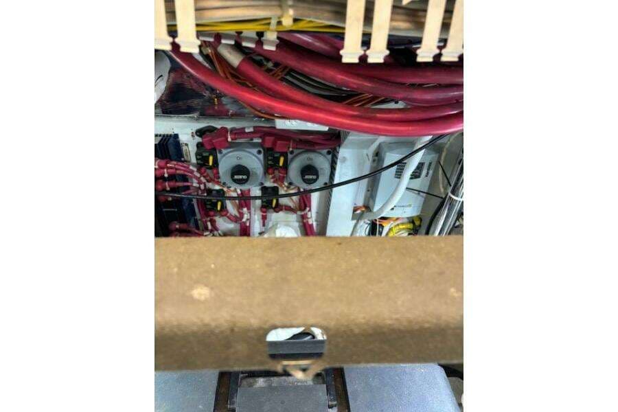 Engine room of 2004 Carver 466 Motor Yacht with visible wiring and components.