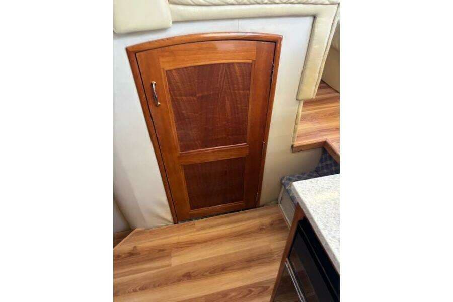 Wooden door inside 2004 Carver 466 Motor Yacht, featuring elegant interior design.