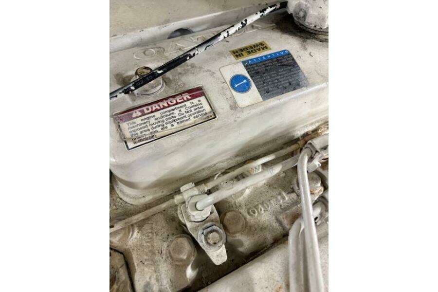 Engine compartment of 2004 Carver 466 Motor Yacht with warning labels.