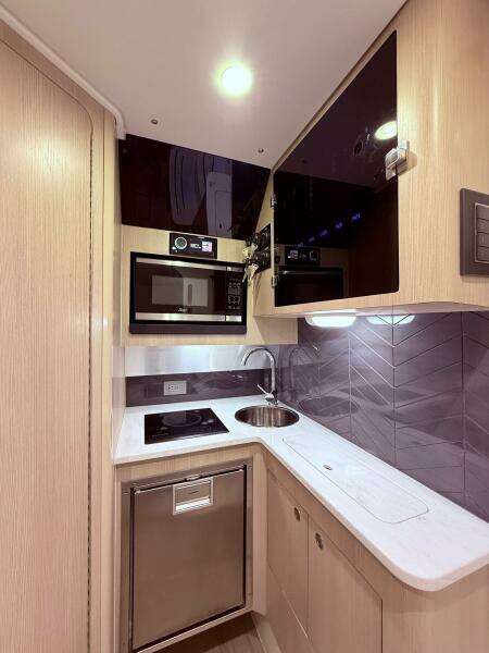 2024 Scout 400 LXF yacht kitchen with modern appliances and sleek design.