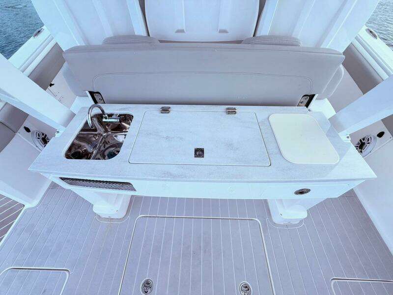 2024 Scout 400 LXF boat interior with sink and cutting board on deck.