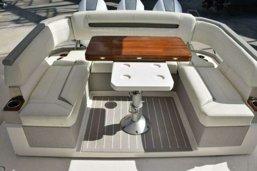 Cockpit With Rotating Aft Seating Console, Wood Tabletop Which Folds Open Or Can Be Lowered To Make Sunbed