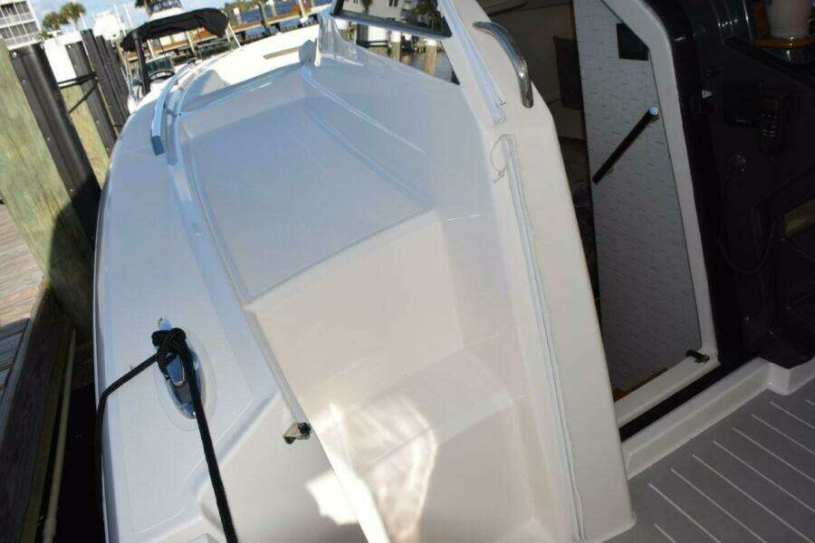 Portside Boarding Steps Make Fixed Dock Access Easy. Cabin Entry Door To Left Of Helm