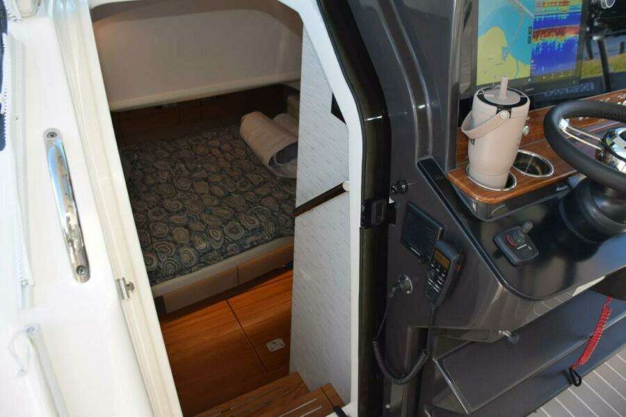 Cabin Interior Entryway. Sliding Hideaway, Dark Tinted, Acrylic Door. Vhf Radio With External Speaker