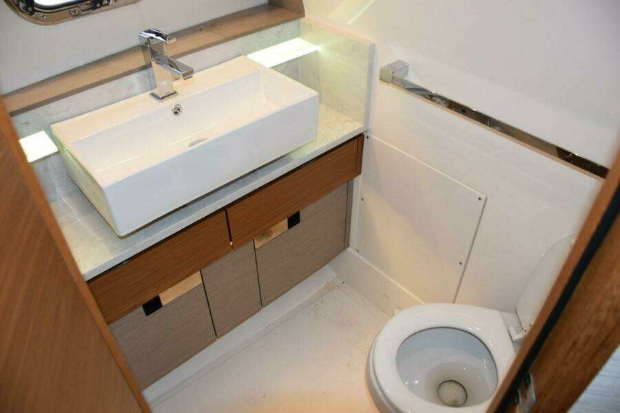 Nicely Finished Bathroom With Door And Freshwater Toilet