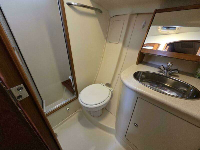 Aft head with shower compartment