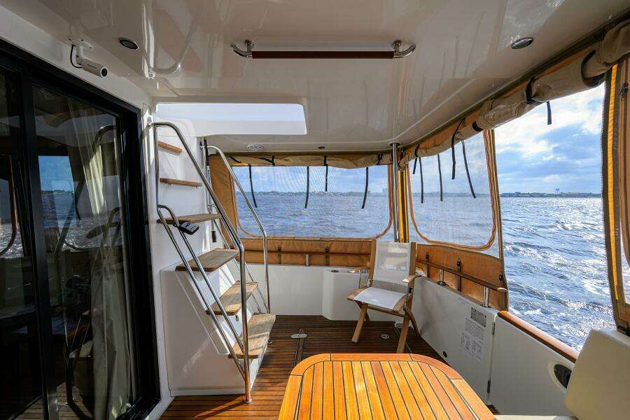 Beneteau 44 Stellar Seascape  - Aft Deck, Dining, Seating, Stairs to Bridge